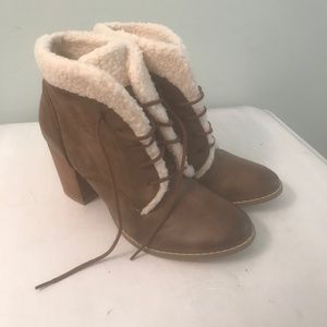 Restricted brown distressed booties